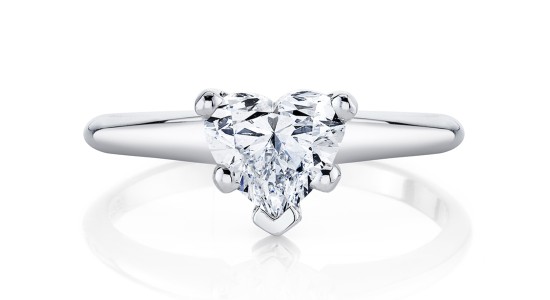 a white gold solitaire engagement ring with heart shaped diamond