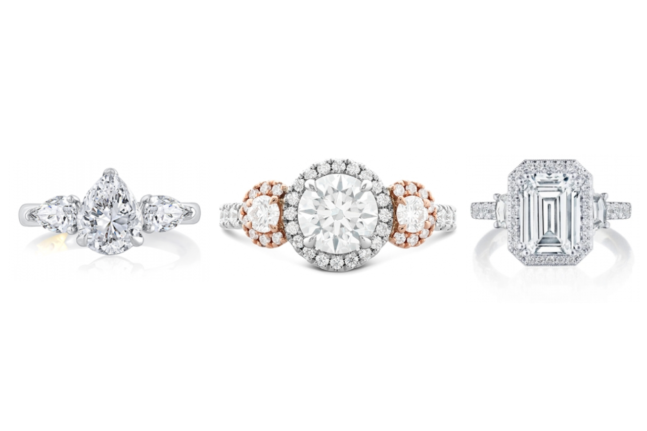 A collection of three stone engagement rings, available at Rogers Jewelry Co.